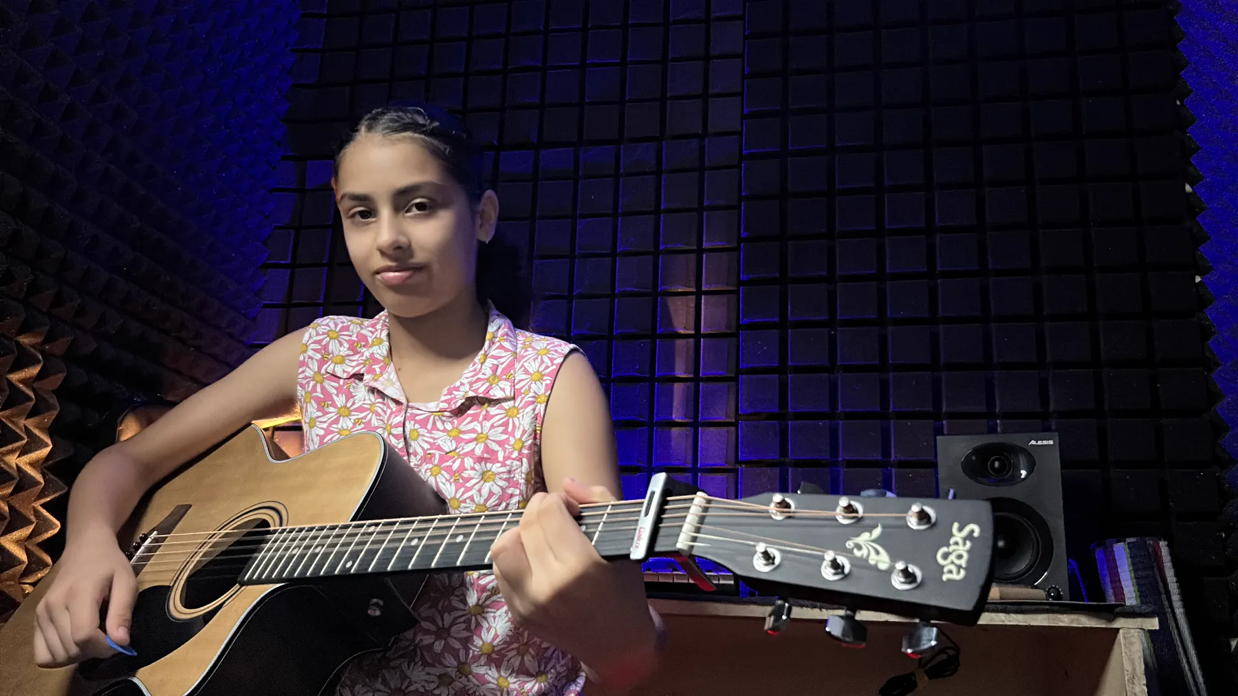 Student practising guitar at DSM