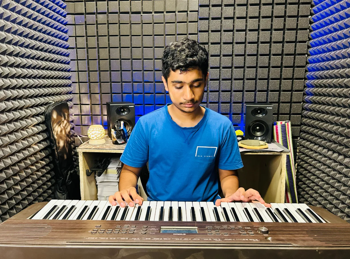 A student practising keys in the school studio