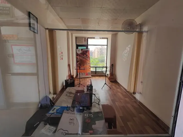 The DSM Dwarka Sector 22 academy interior with music stands and instruments